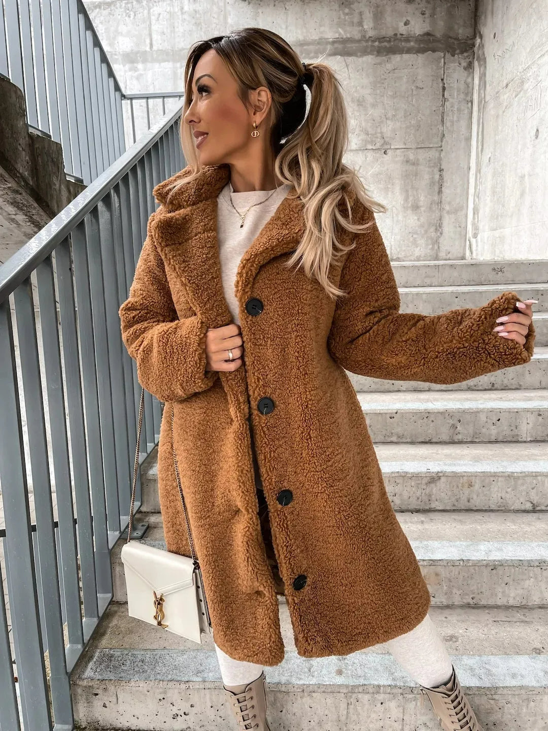 Chic women's longline teddy coat. Stylish and comfortable plush outerwear for a trendy fall look.