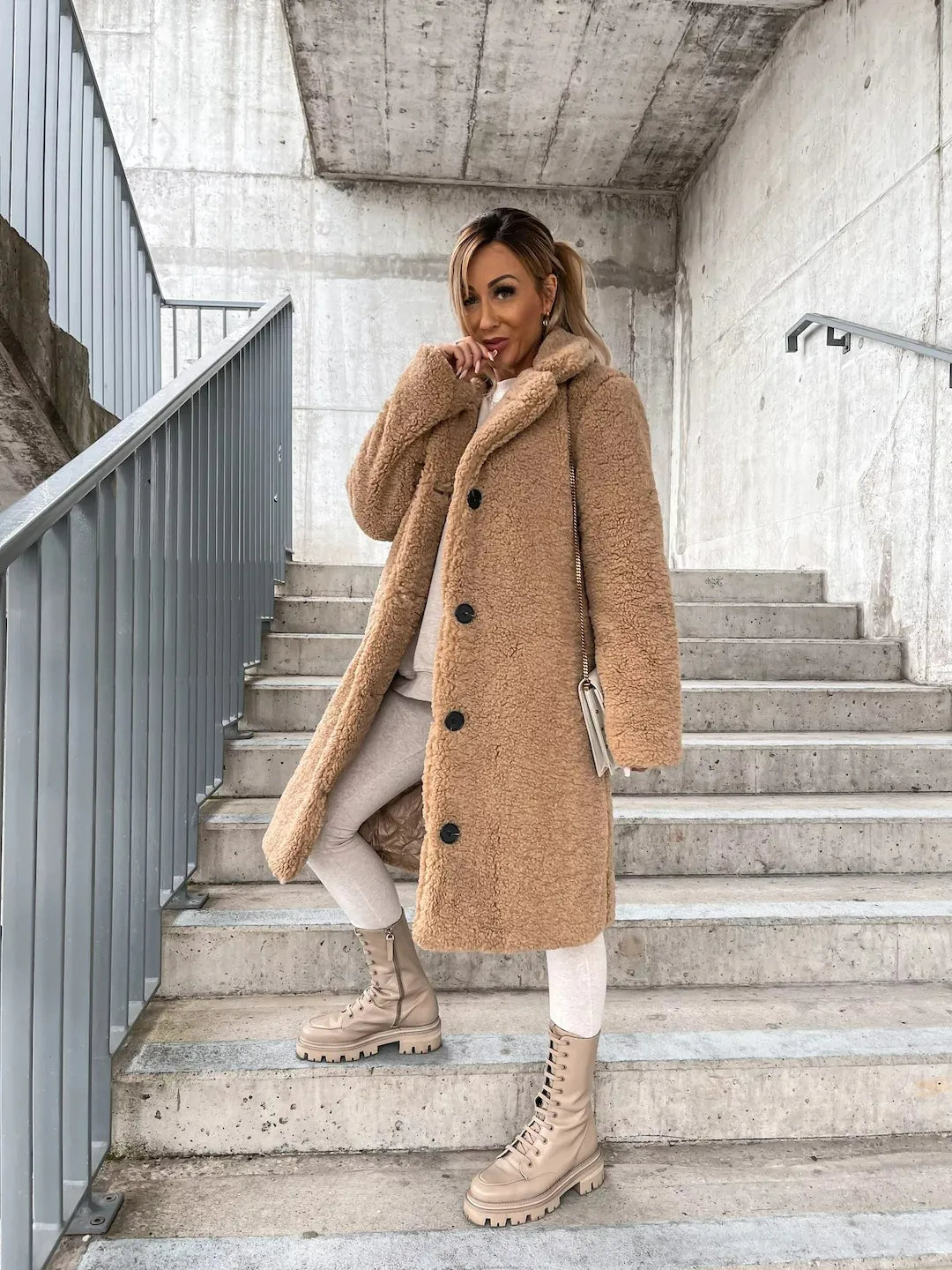 Comfortable women's plush longline teddy coat. A cozy and stylish jacket for chic winter fashion.