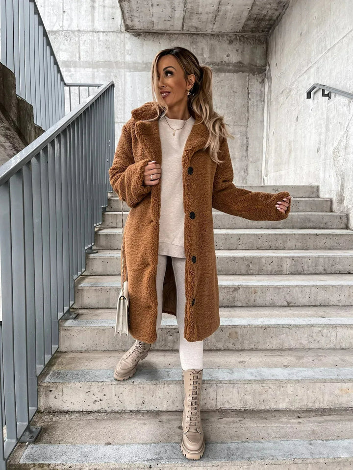Women's warm longline teddy coat. Plush and cozy outerwear, perfect for stylish fall and winter comfort.