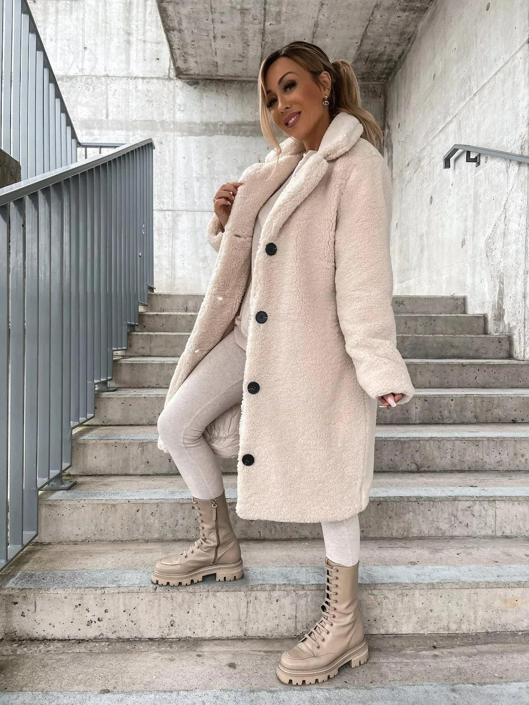 Luxurious plush teddy longline coat for women. Soft, chic, and warm outerwear for winter fashion.