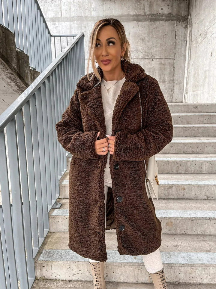 Stay cozy and chic in this women's plush longline teddy coat. Stylish warm outerwear for fall & winter.