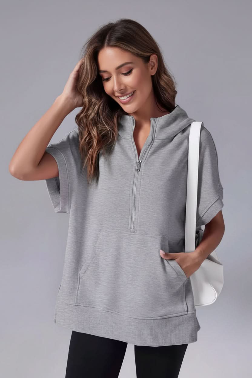 Pink women's cozy short sleeve half-zip hoodie. Relaxed fit pullover for comfortable everyday casual wear.