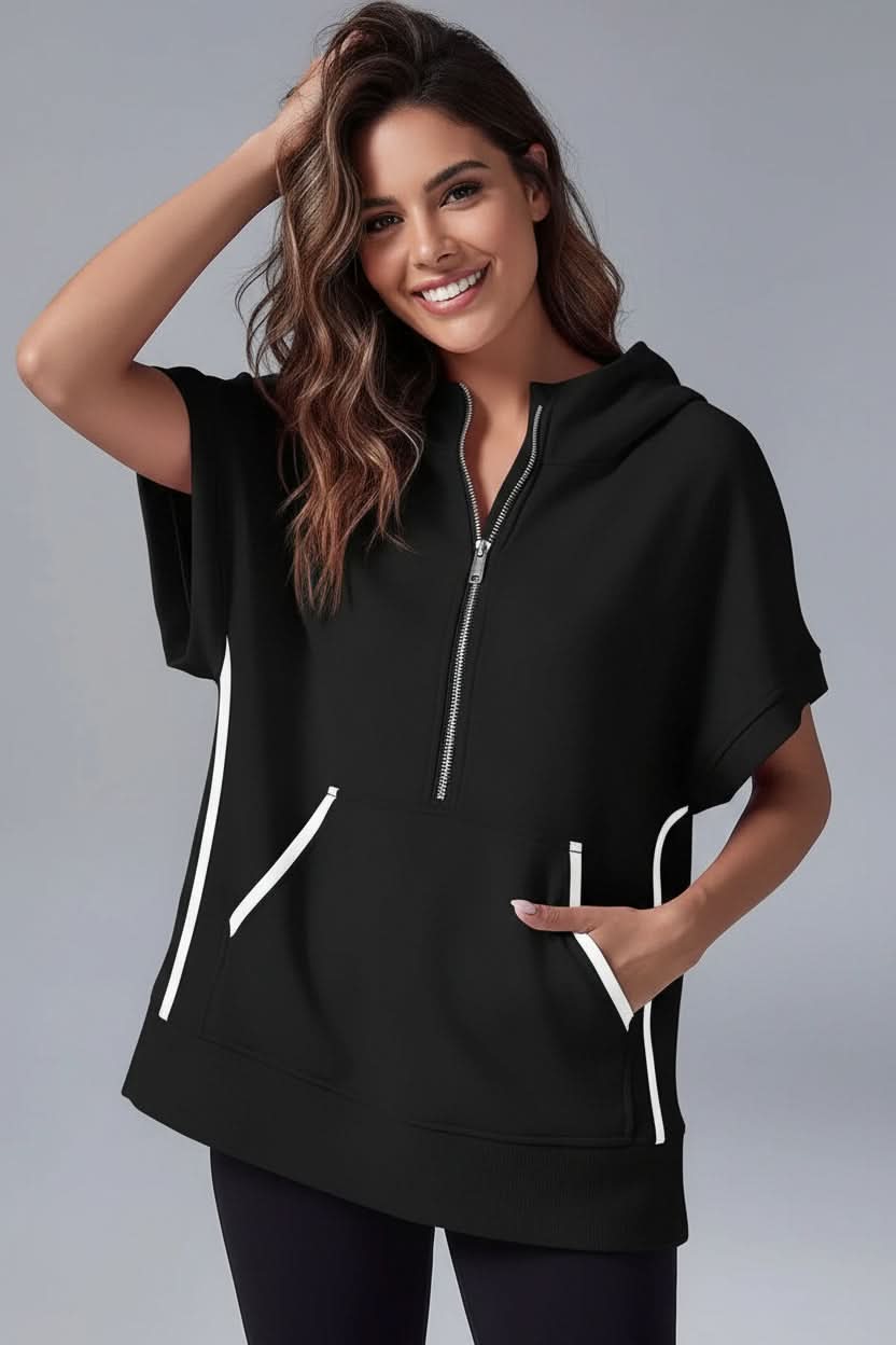 White women's relaxed fit short sleeve hoodie. Versatile half-zip pullover for cozy loungewear and comfort.