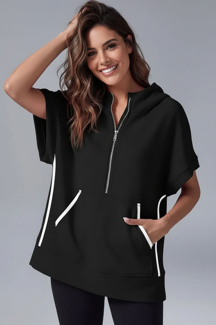 White women's relaxed fit short sleeve hoodie. Versatile half-zip pullover for cozy loungewear and comfort.