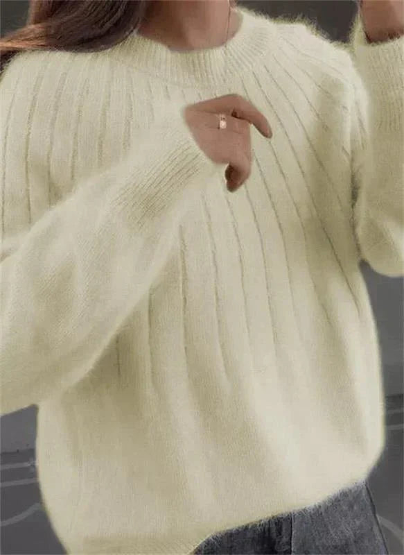 Stylish women's long sleeve textured knit sweater. Cozy and warm, great for winter fashion and daily comfort.