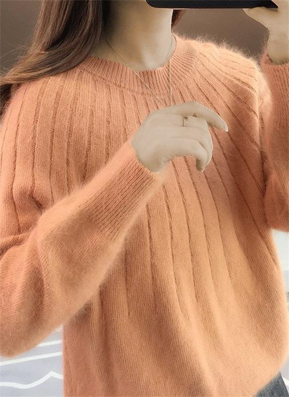 Elegant women's fall fashion sweater. Long sleeve, cozy knit, and stylish texture for comfortable versatile wear.