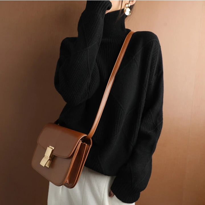 Elegant women's knitwear turtleneck, offering warmth & chic fall style.