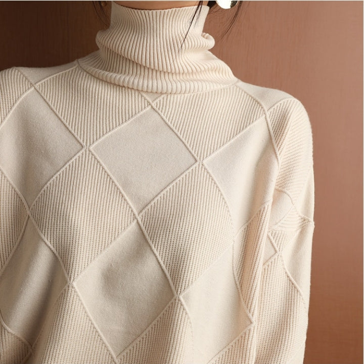 Relaxed fit women's knit turtleneck, perfect for layering & cozy days.