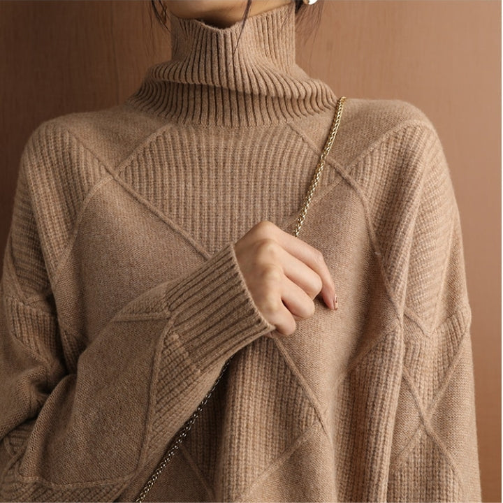 Chunky knit women's turtleneck sweater, providing ultimate warmth for winter.