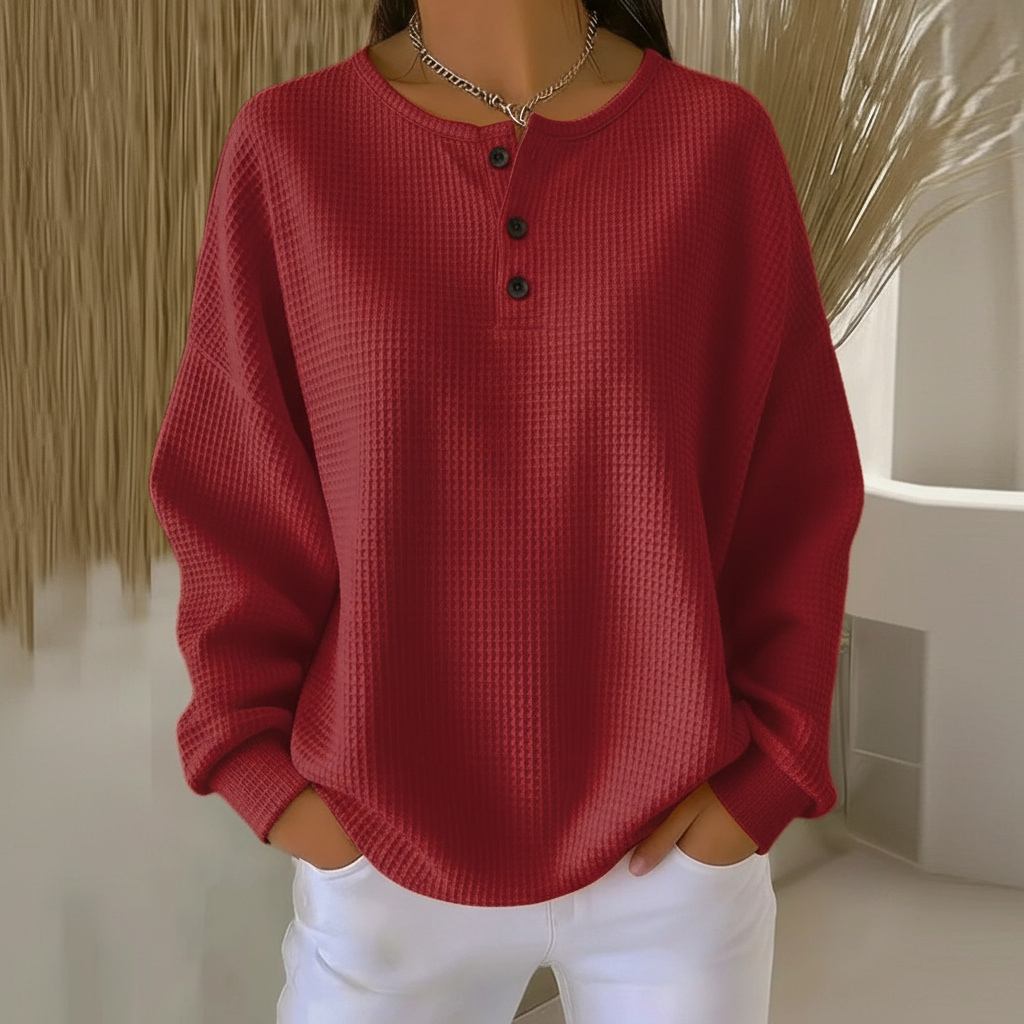 Soft women's waffle knit pullover with a relaxed fit and long sleeves, ideal for cozy casual wear.