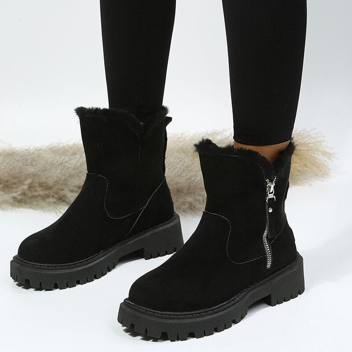 Insulated women's snow ankle boots with durable traction sole, ideal for winter fashion & comfort.