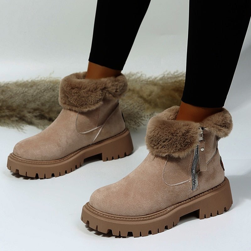 Fashionable women's snow boots with enhanced traction for icy conditions, ensuring warm & cozy winter comfort.
