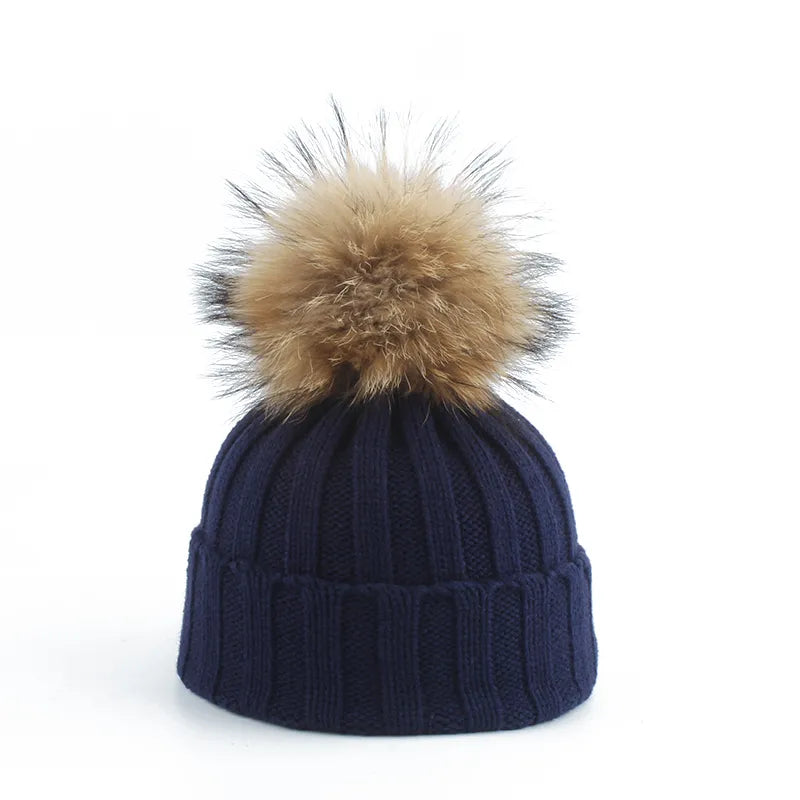 Warm women's pom-pom beanie, ideal for winter adventures. Cozy, stylish cold weather headwear.