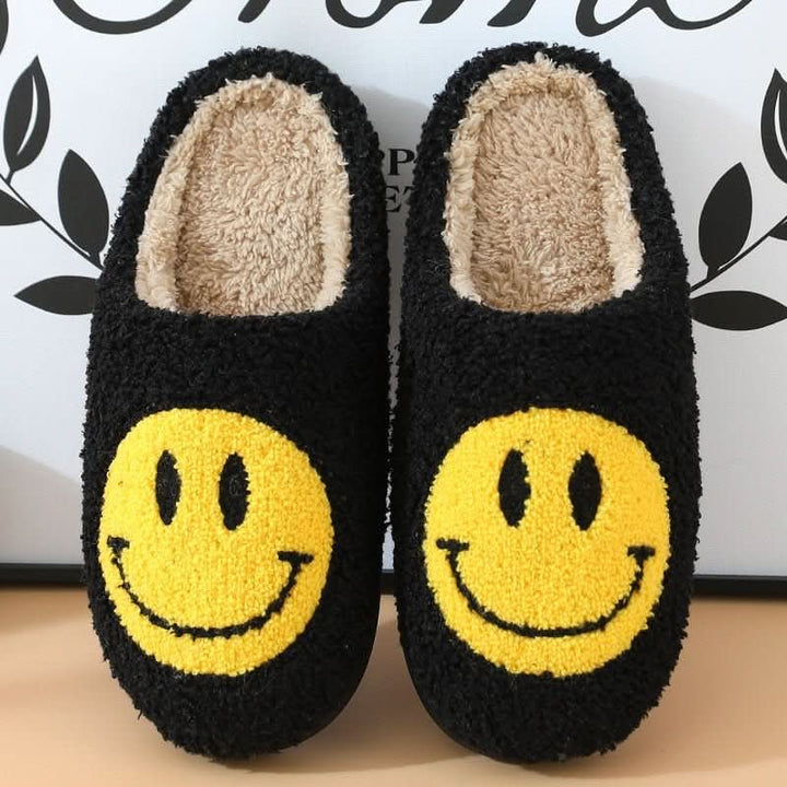 Women's warm smiley winter slippers, cozy house shoes with a thick sole for plush indoor comfort.