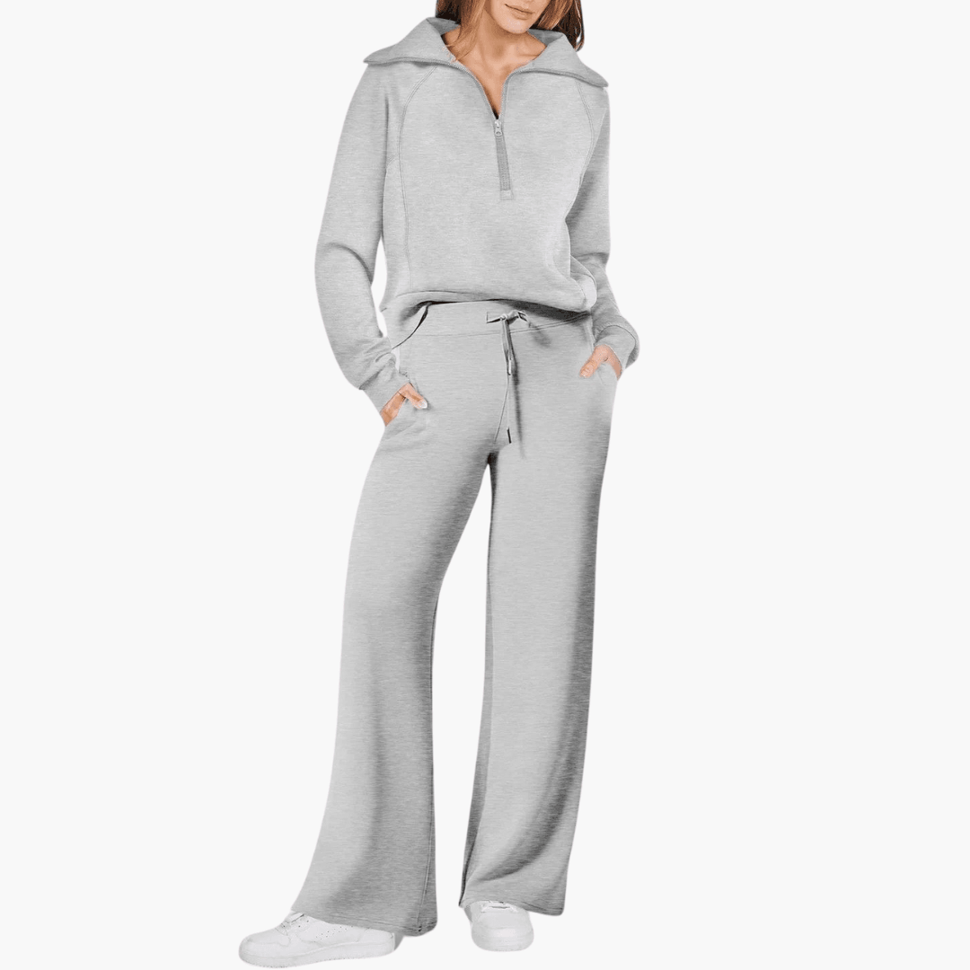 Stylish women's matching zip-up hoodie and wide-leg pant lounge set. Versatile two-piece casual outfit.