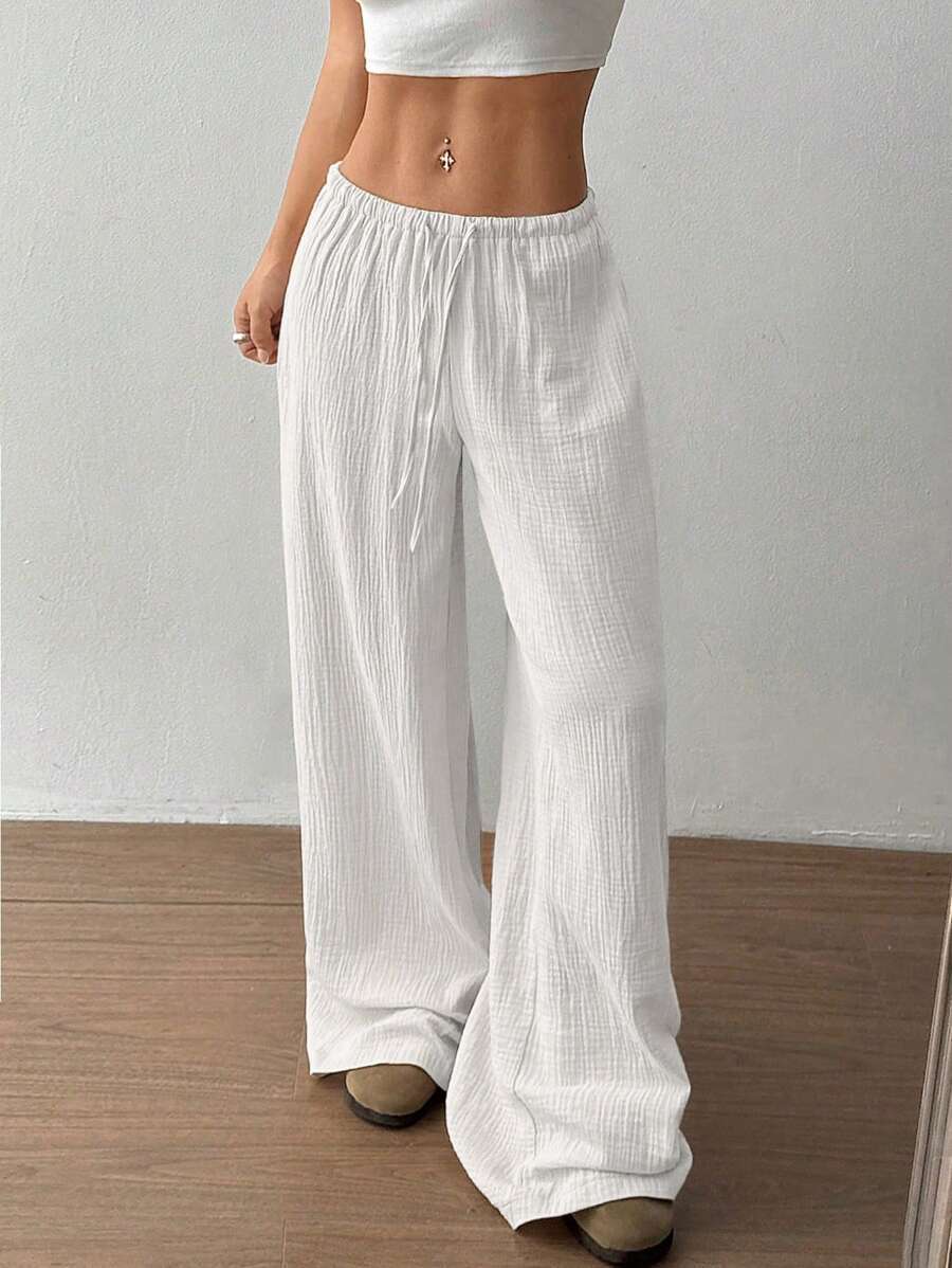 Versatile women's wide-leg drawstring crinkle pants, great for casual summer outfits and comfort.