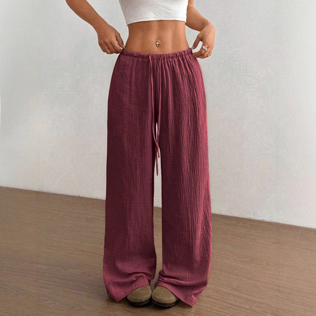 Front view of women's crinkle wide-leg drawstring pants, highlighting relaxed fit and bohemian charm.