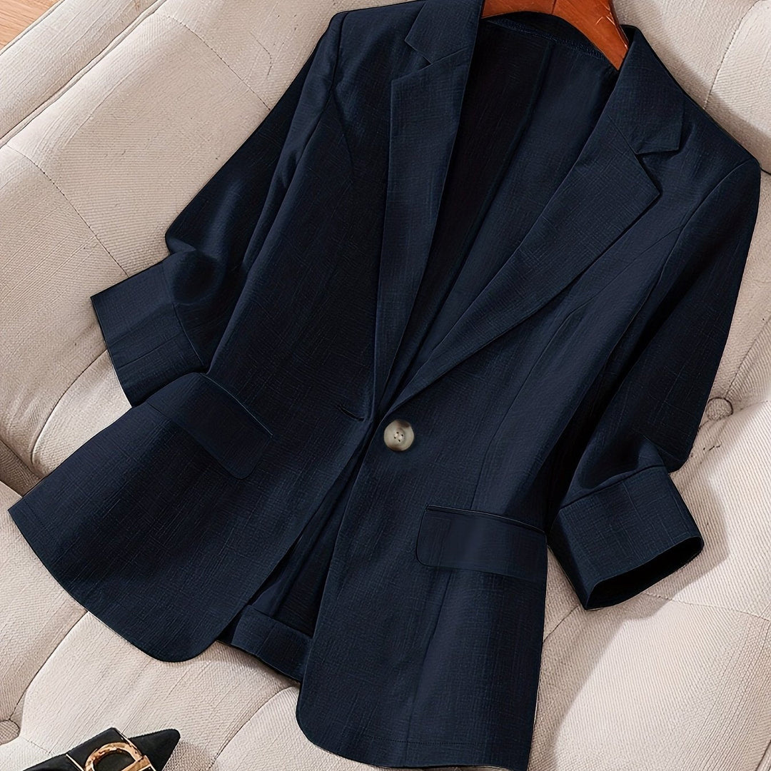 Lightweight women's cropped blazer, offering modern office wear comfort.