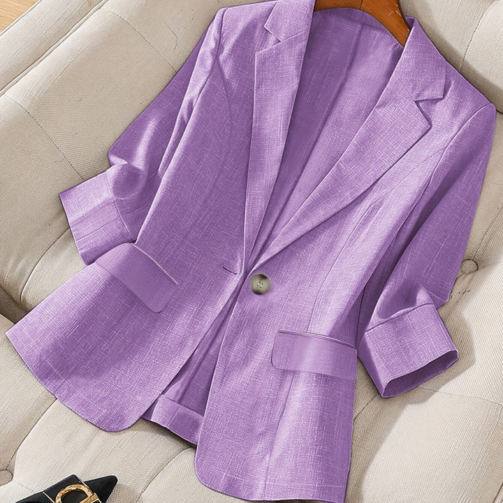 Modern women's cropped blazer with a chic three-quarter sleeve design.