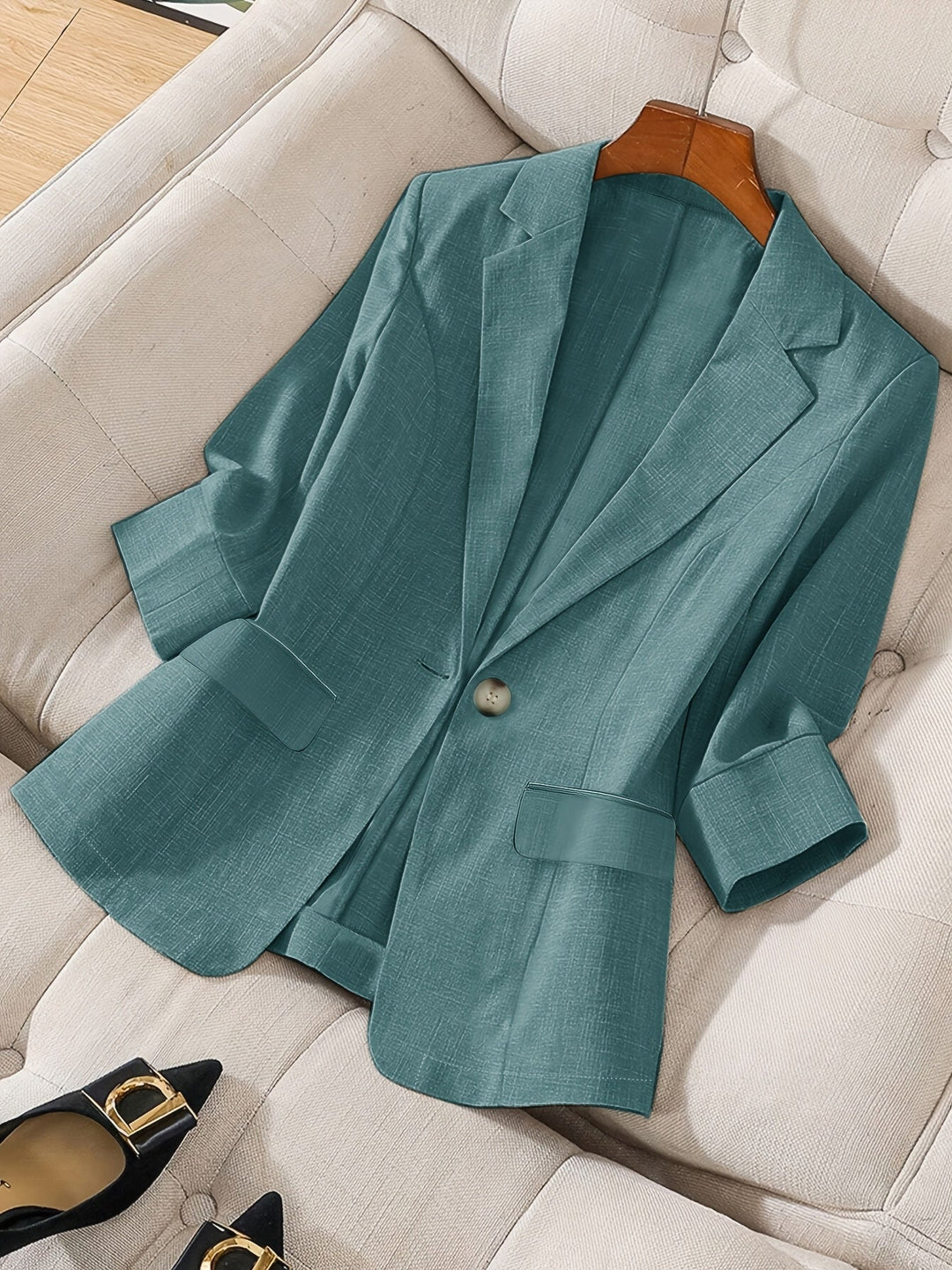 Modern business style with a women's tailored cropped blazer.