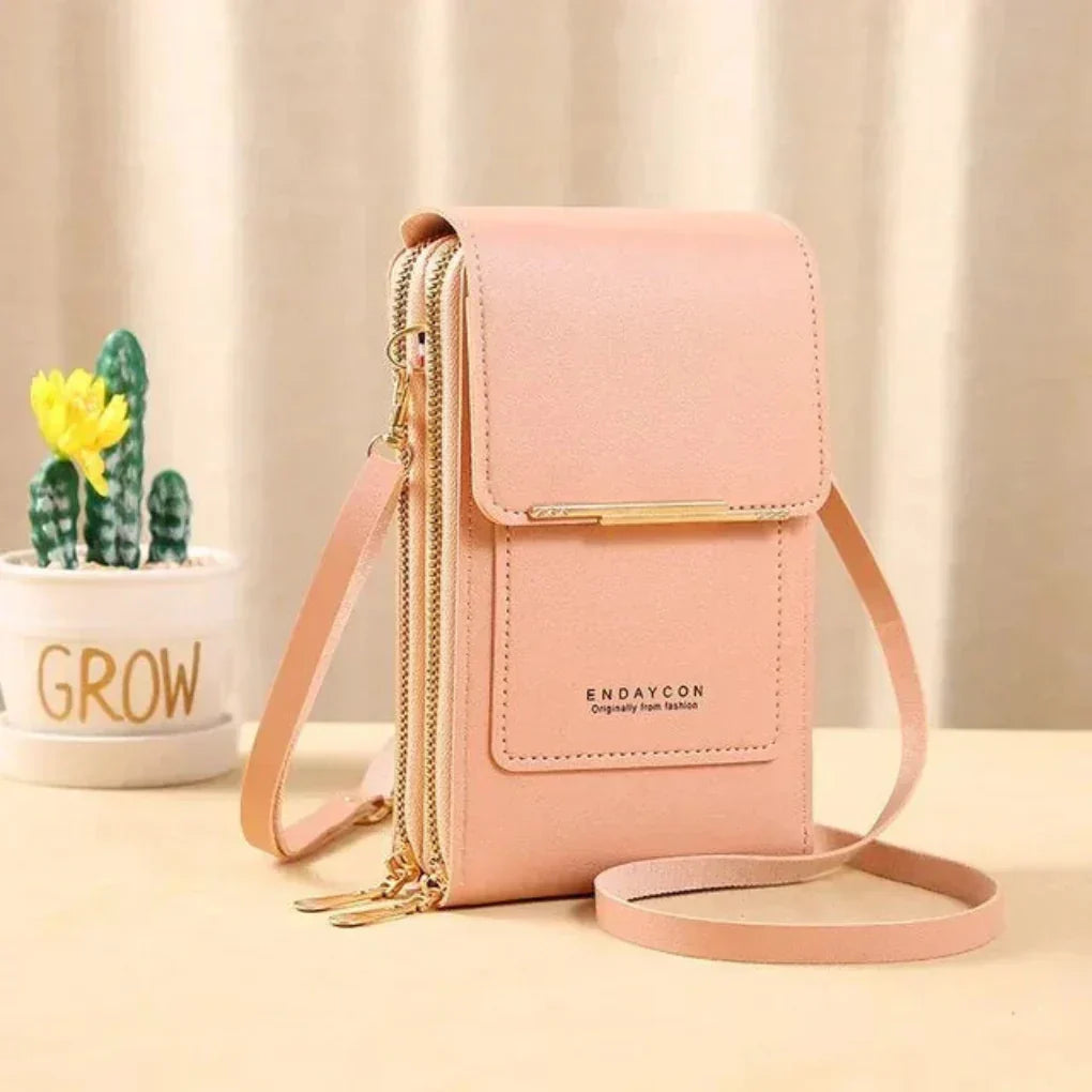 Compact women's phone crossbody bag featuring organized compartments & a clear touchscreen pocket.