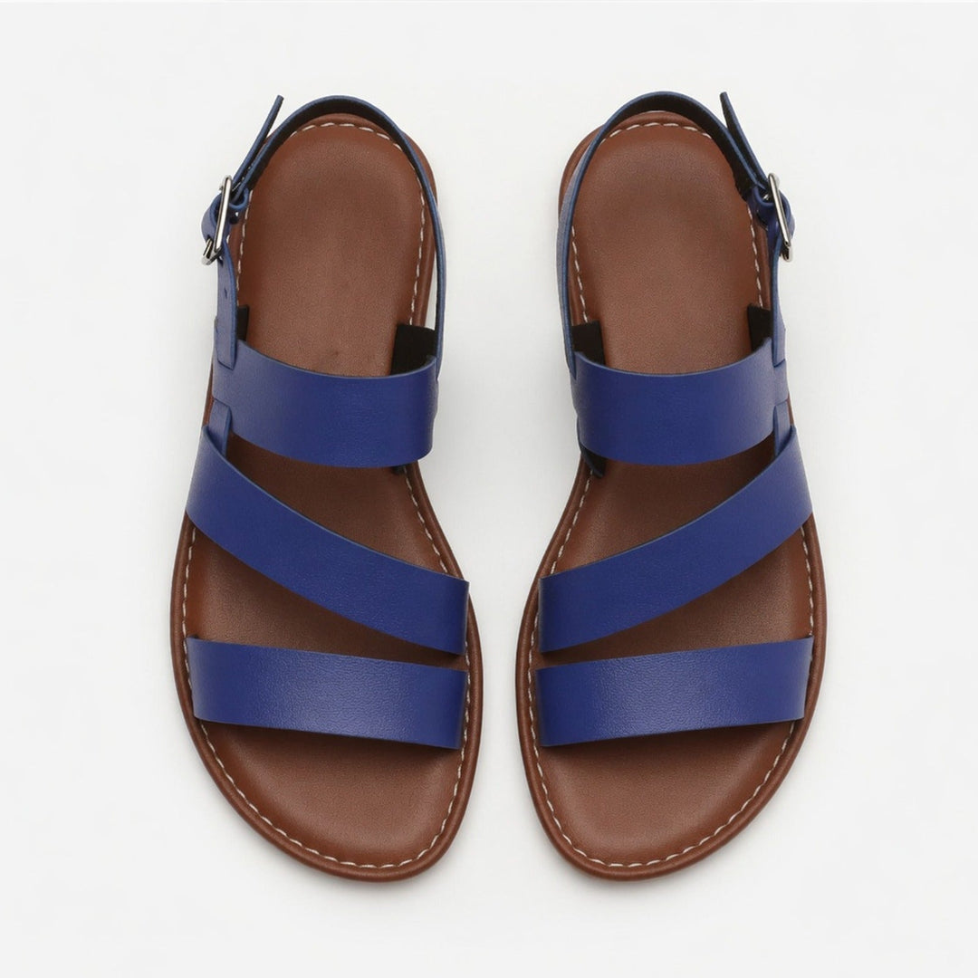 Versatile women's flat sandals, open toe, with comfortable crossover straps for casual summer fashion.
