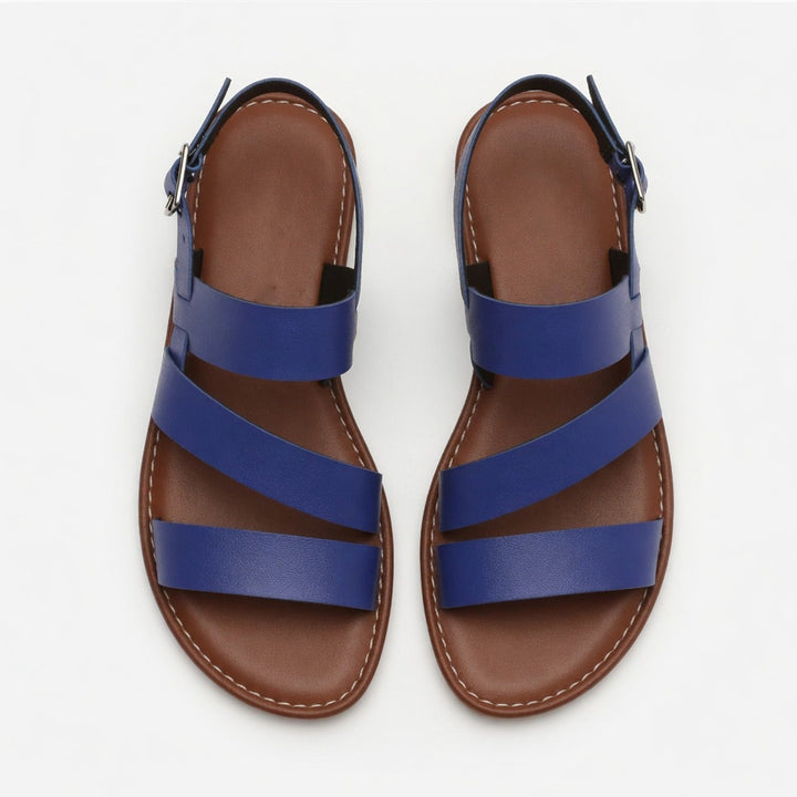 Versatile women's flat sandals, open toe, with comfortable crossover straps for casual summer fashion.
