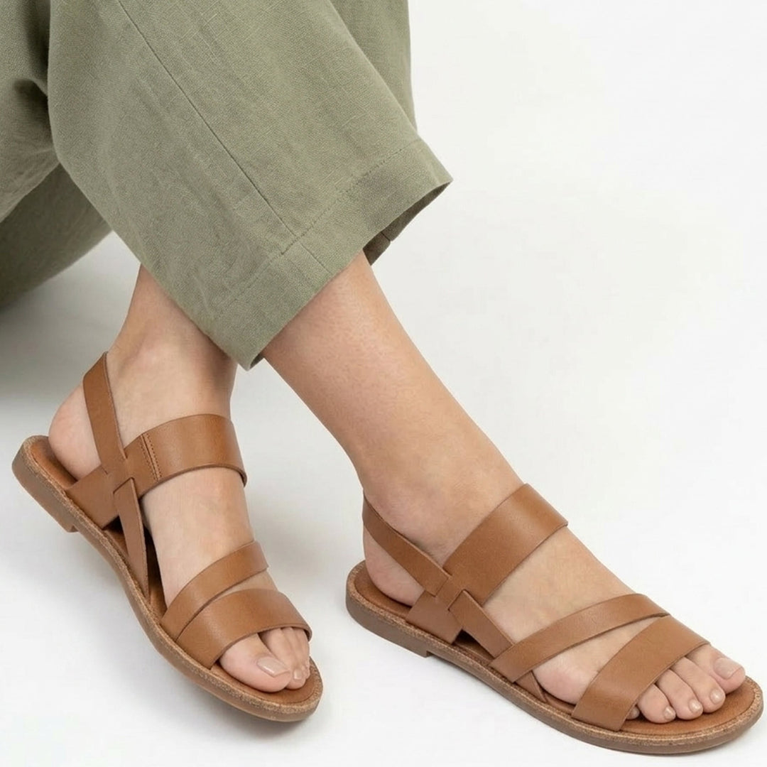 Soft & comfortable women's open-toe flat sandals with crossover straps, ideal for everyday wear.