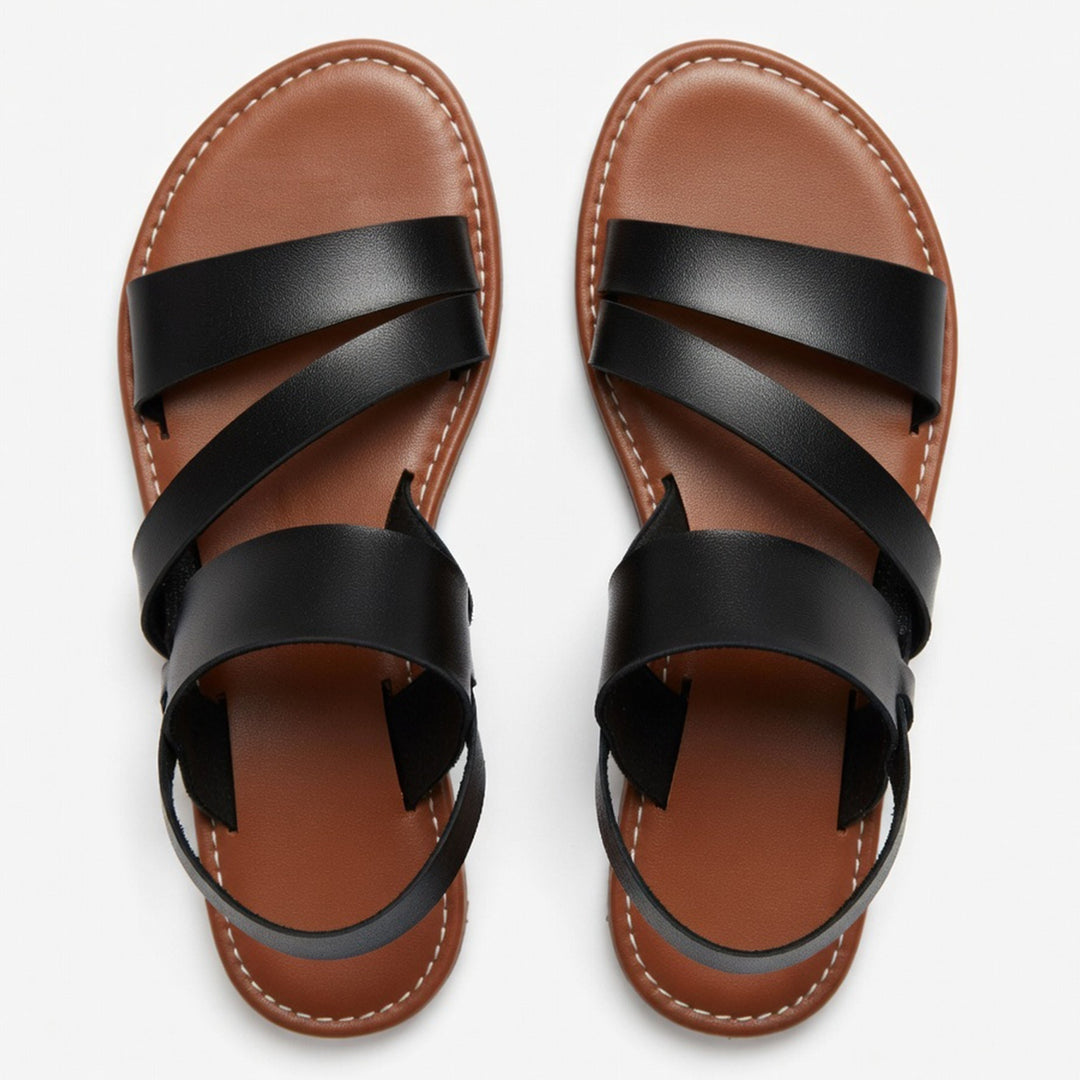 Women's flat sandals with crossover strap and open toe, great for comfortable summer walks.