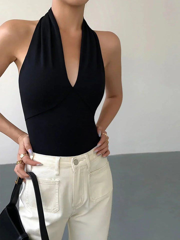 Women's crossover V-neck halter top, sleeveless for casual wear & everyday fashion. Stylish spring/summer top.