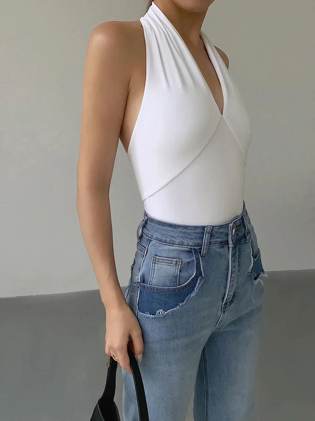 Women's slim fit V-neck halter top, sleeveless for ultimate summer comfort. Everyday fashion essential.