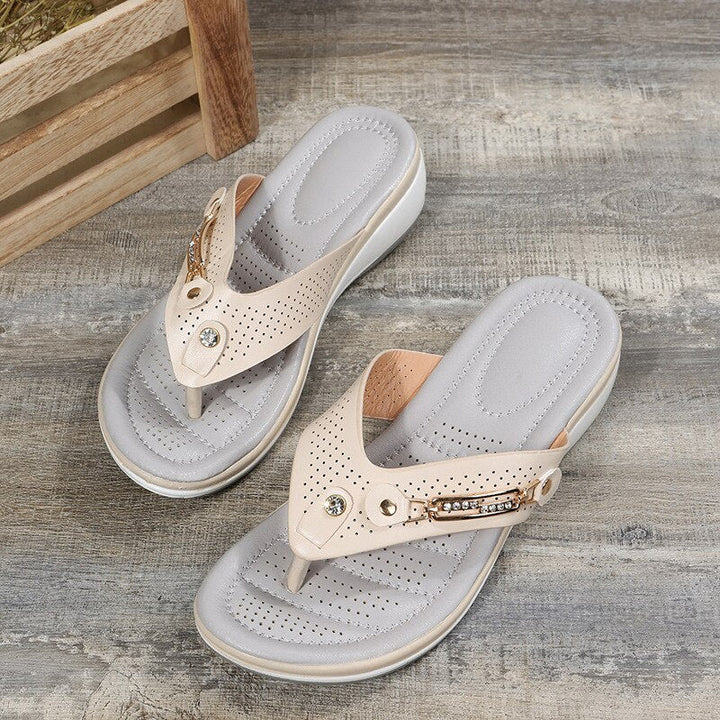 Stylish women's flip flops featuring cushioned comfort and a unique decorative strap for summer beach days.
