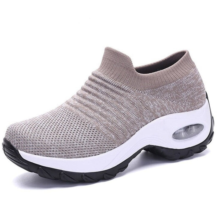 Side view of women's health shoes, showcasing the cushioned sole and supportive design for orthopedic comfort.