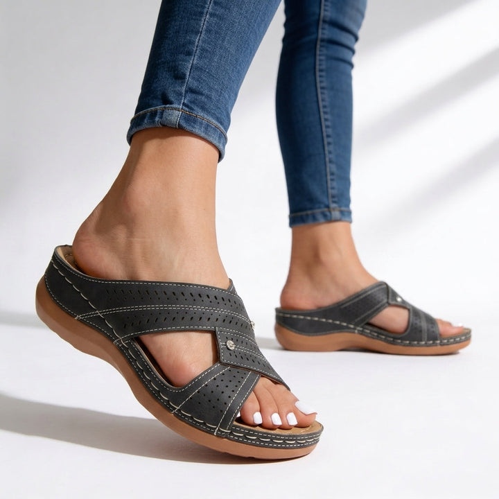 Stylish women's peep toe wedge sandals with crossover straps. Comfortable slip-on design for casual summer wear.