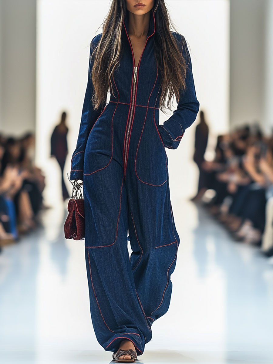Women's dark blue wide leg jumpsuit with long sleeve zip front. Casual elegance & modern style.