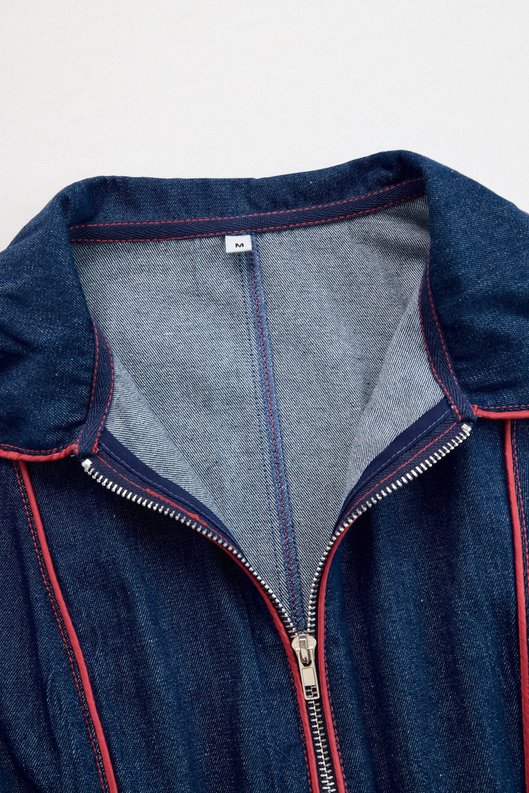 Women's dark blue wide leg jumpsuit, long sleeve zip front, ideal for office wear or casual elegance.