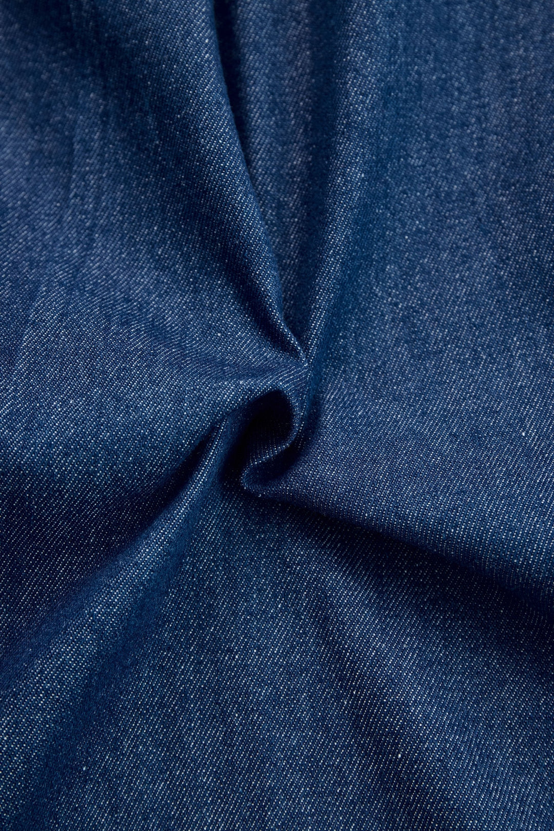 Women's dark blue wide leg jumpsuit, long sleeve zip front with subtle contrast stitching. Versatile.