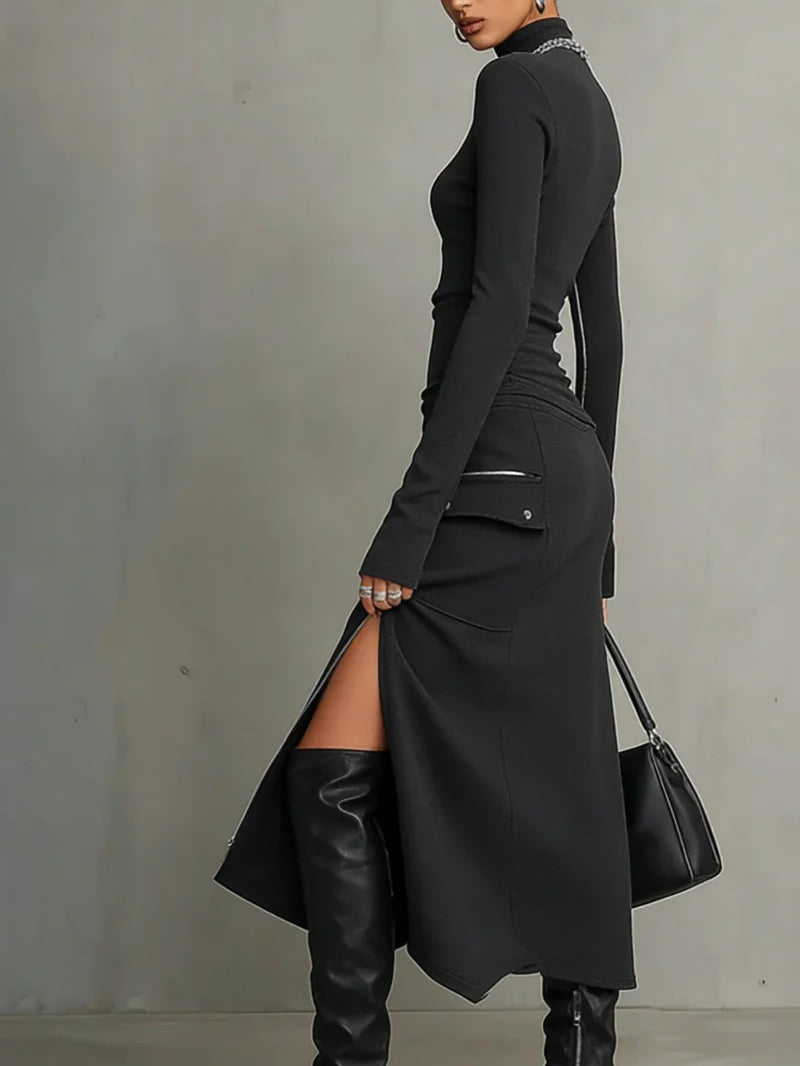 Close-up of a women's dark grey knit turtleneck top & matching zipper skirt set. Stylish casual wear.