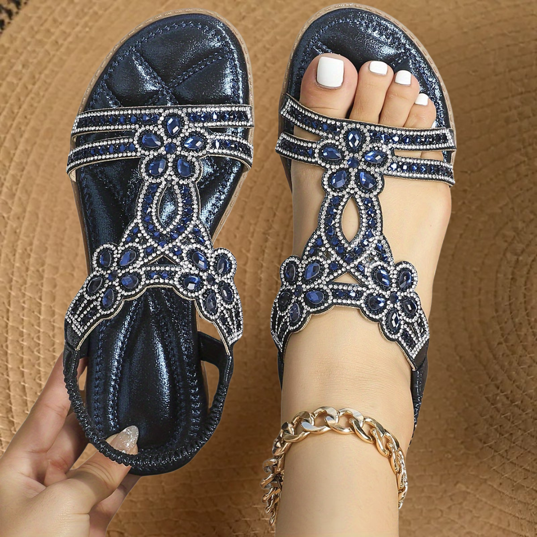 Women's flat sandals featuring brilliant rhinestones, perfect for summer and casual wear.