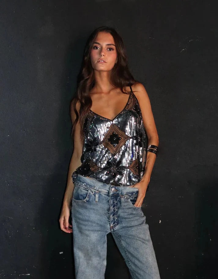 Elegant women's sleeveless sequin top, a glamorous glitter party top for festive evening wear and night outs.