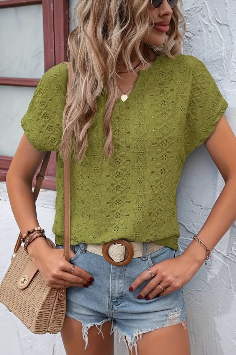 Fashionable women's notched t-shirt with delicate eyelet details and short sleeves for relaxed summer wear.