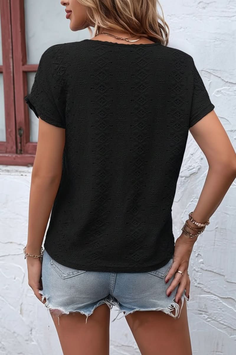Delicate eyelet women's t-shirt, short sleeve, showcasing a unique notched neckline for casual elegance.