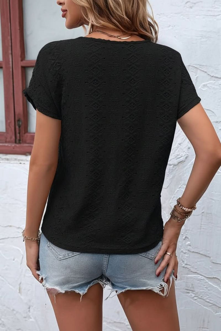 Delicate eyelet women's t-shirt, short sleeve, showcasing a unique notched neckline for casual elegance.