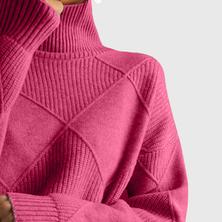 Oversized fit women's sweater, long sleeve & comfortable, with a cozy roll neck.