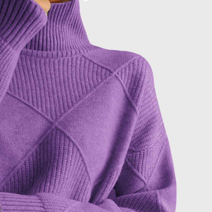 Relaxed style women's cozy knit jumper, versatile for winter, featuring a roll neck.