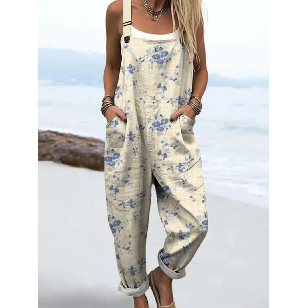 Women's ditsy floral boho jumpsuit with adjustable straps, perfect for summer casual wear or vacation.