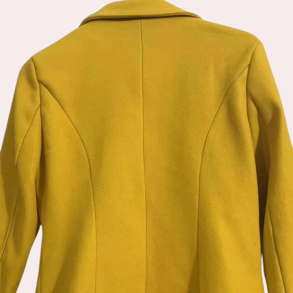 Stylish women's double-breasted trench coat with a belt, ideal for elegant office style and cool winter days.