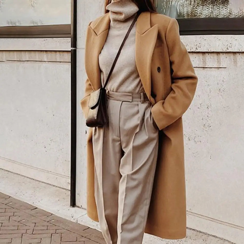 Classic women's long double-breasted trench coat with a tailored fit, sophisticated ladies outerwear for fall/winter.