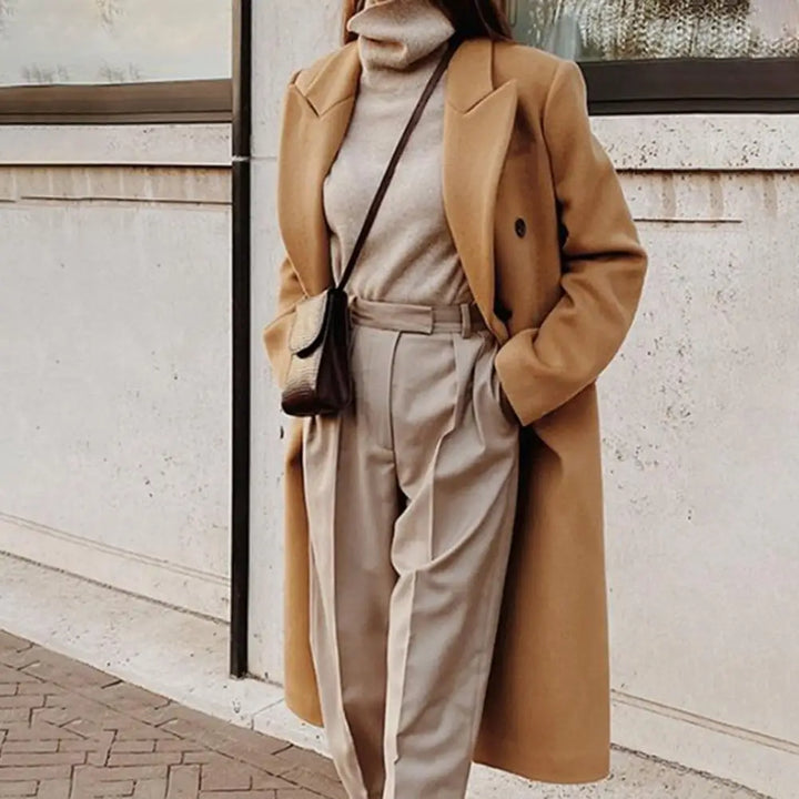 Classic women's long double-breasted trench coat with a tailored fit, sophisticated ladies outerwear for fall/winter.