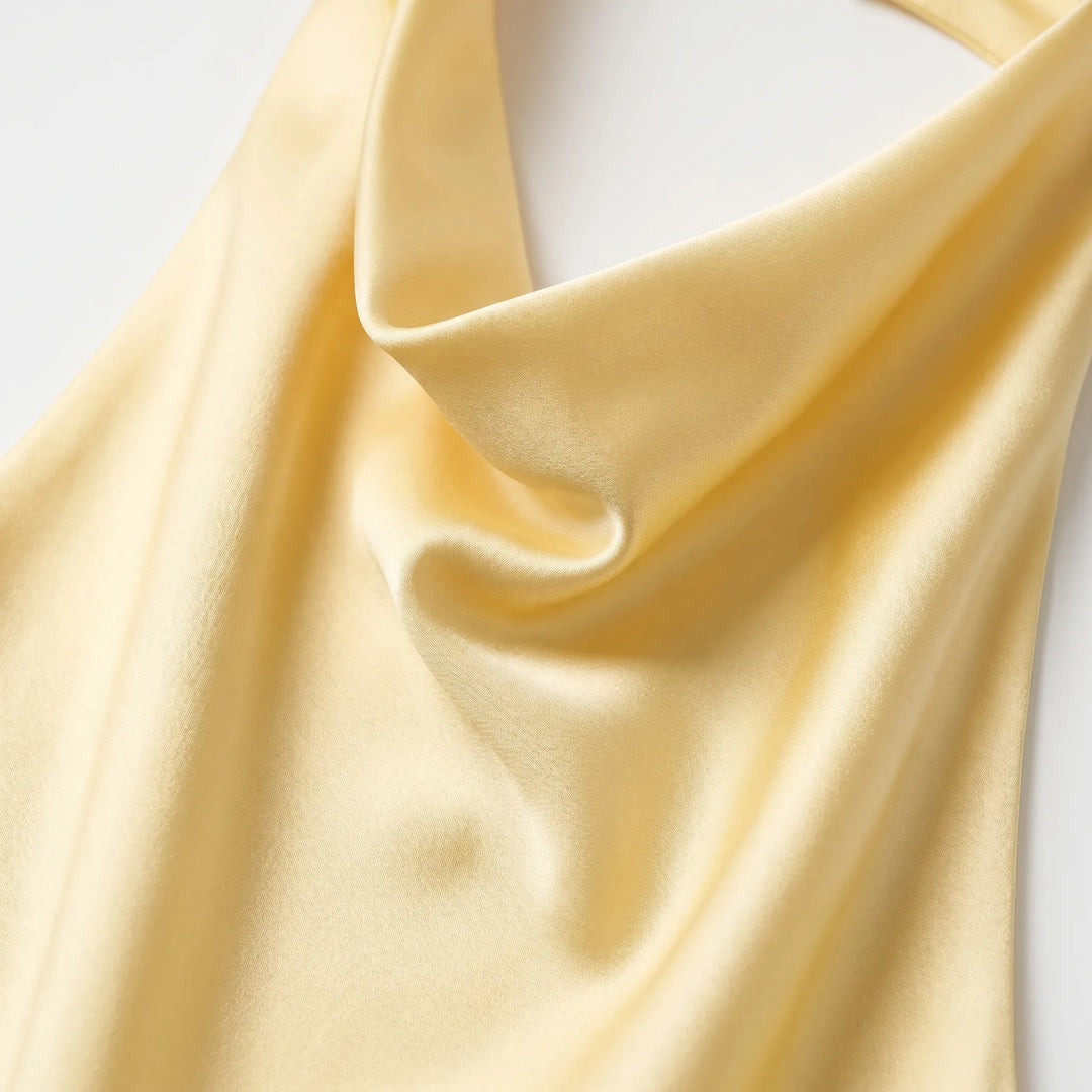 Chic women's halter top with draped neckline, elegant sleeveless for casual or party wear.